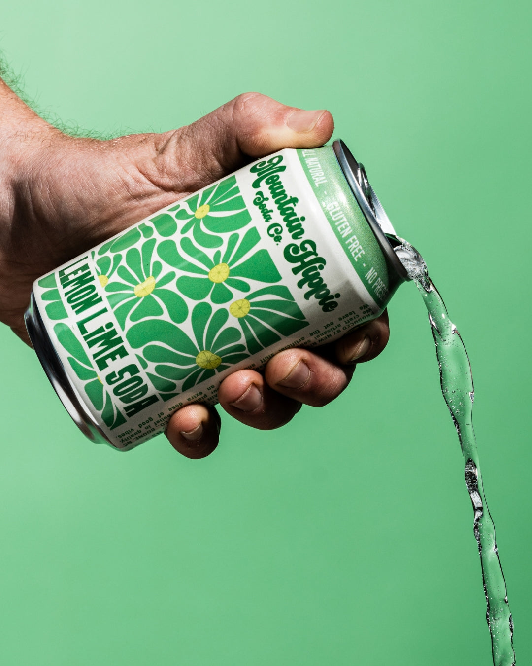 Mountain Hippie Soda Co. Lemon Lime Soda being poured from the can